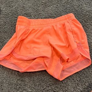 neon pink/orange 4 inch athleta shorts they are more pink than orange